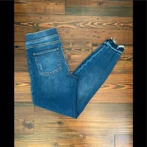 SPANX medium washed distressed ankle jeans